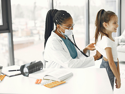 Medical staff and a kid in a clinic